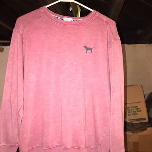 A reddish color pink brand sweatshirt